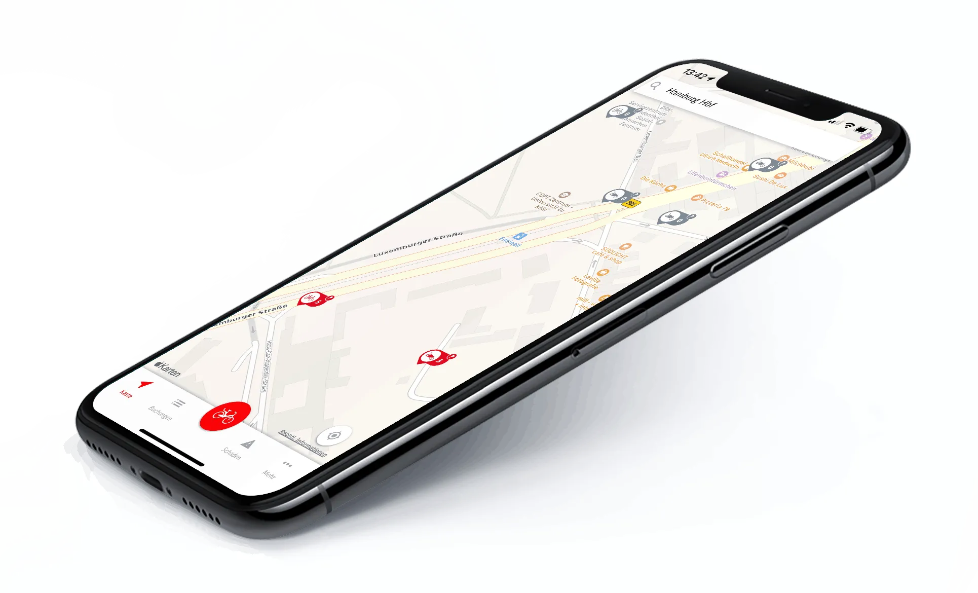 Phone showing the app's map view, with red markers for available bikes across Cologne