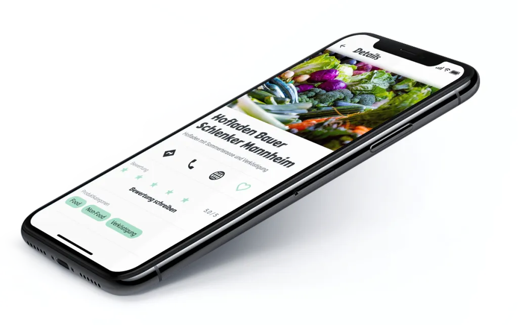 A phone lying flat showing a farm shop's detail page: rating, contact options and product categories